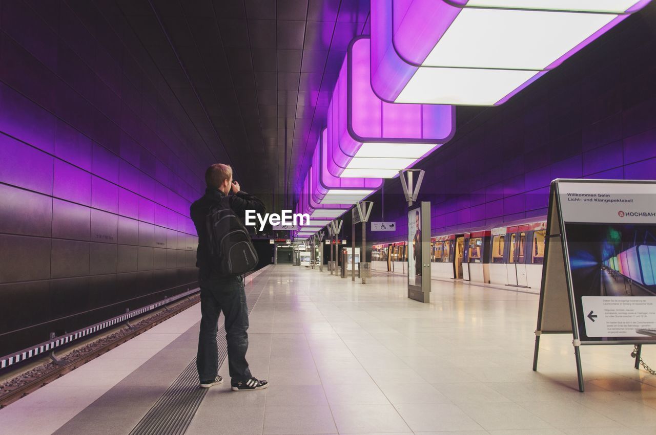 WOMAN WALKING ON SUBWAY STATION