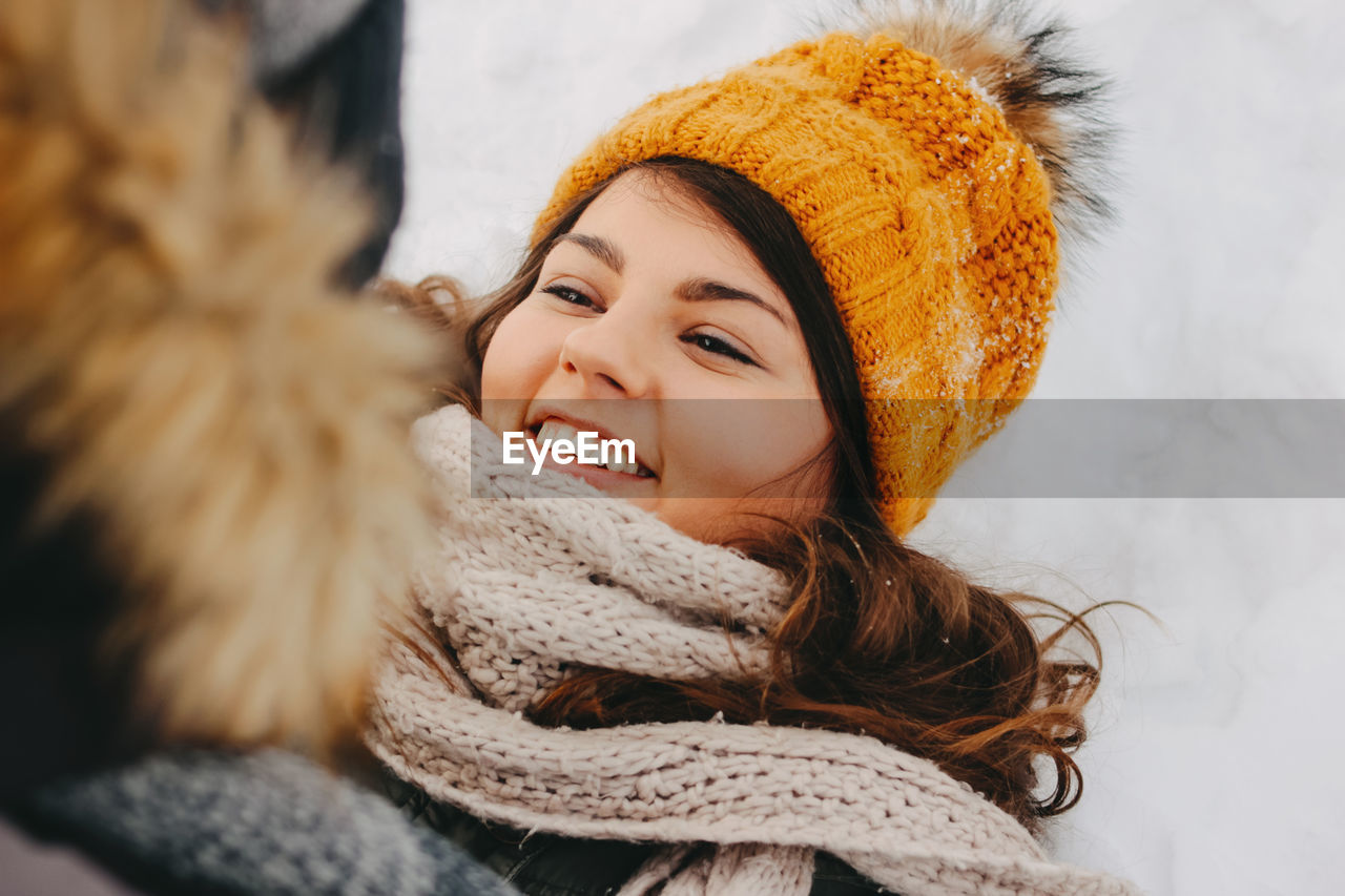 Happy couple in warm clothing during winter