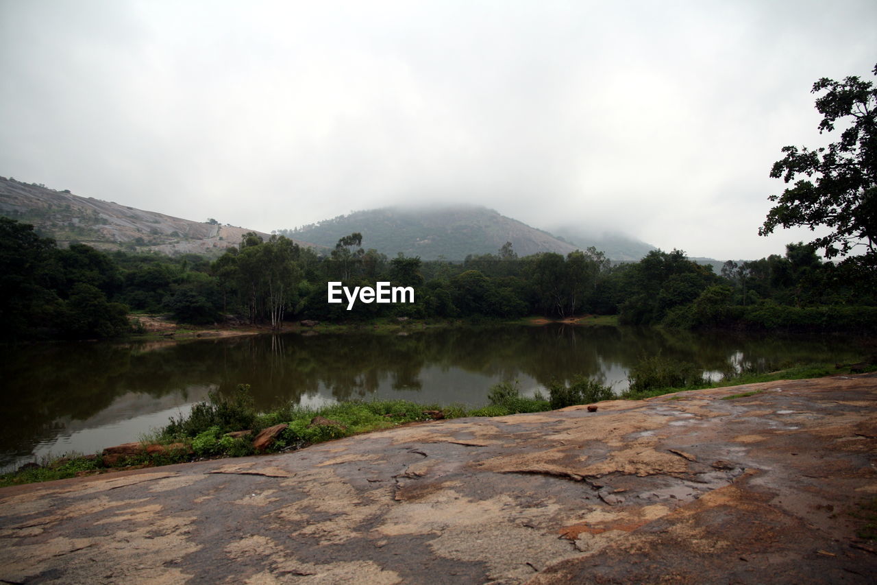 SCENIC VIEW OF LAKE AND MOUNTAINS