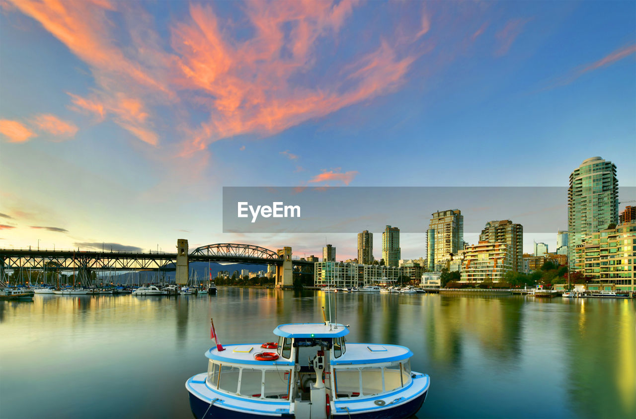 Beautiful view of vancouver skyline with harbor at sunset, british columbia, canada