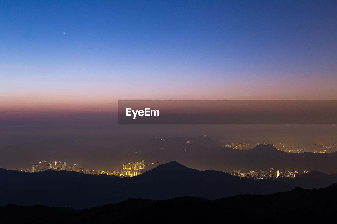 Scenic view of silhouette mountains against sky during sunset