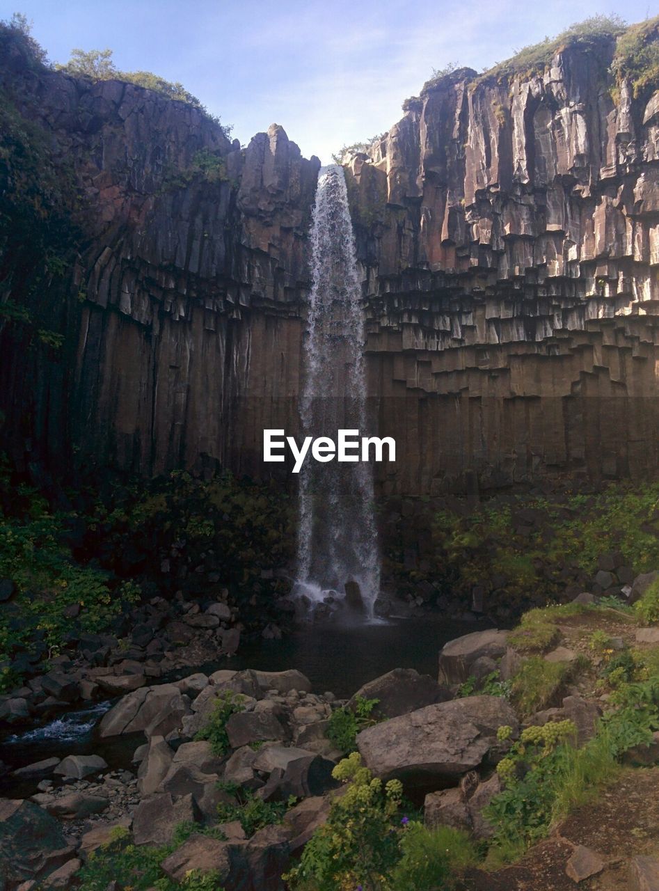 View of waterfall against sky