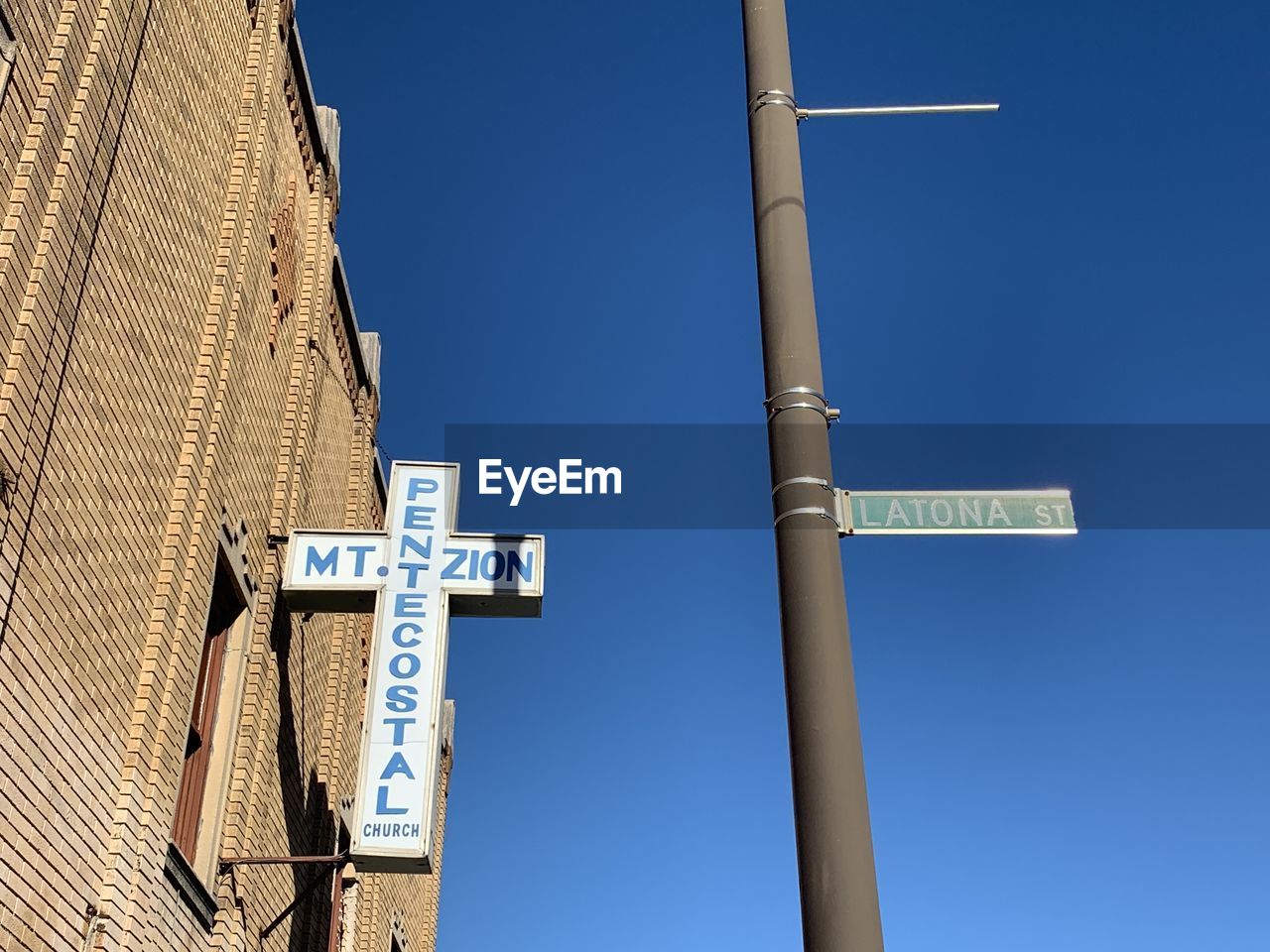 LOW ANGLE VIEW OF SIGN AGAINST CLEAR SKY