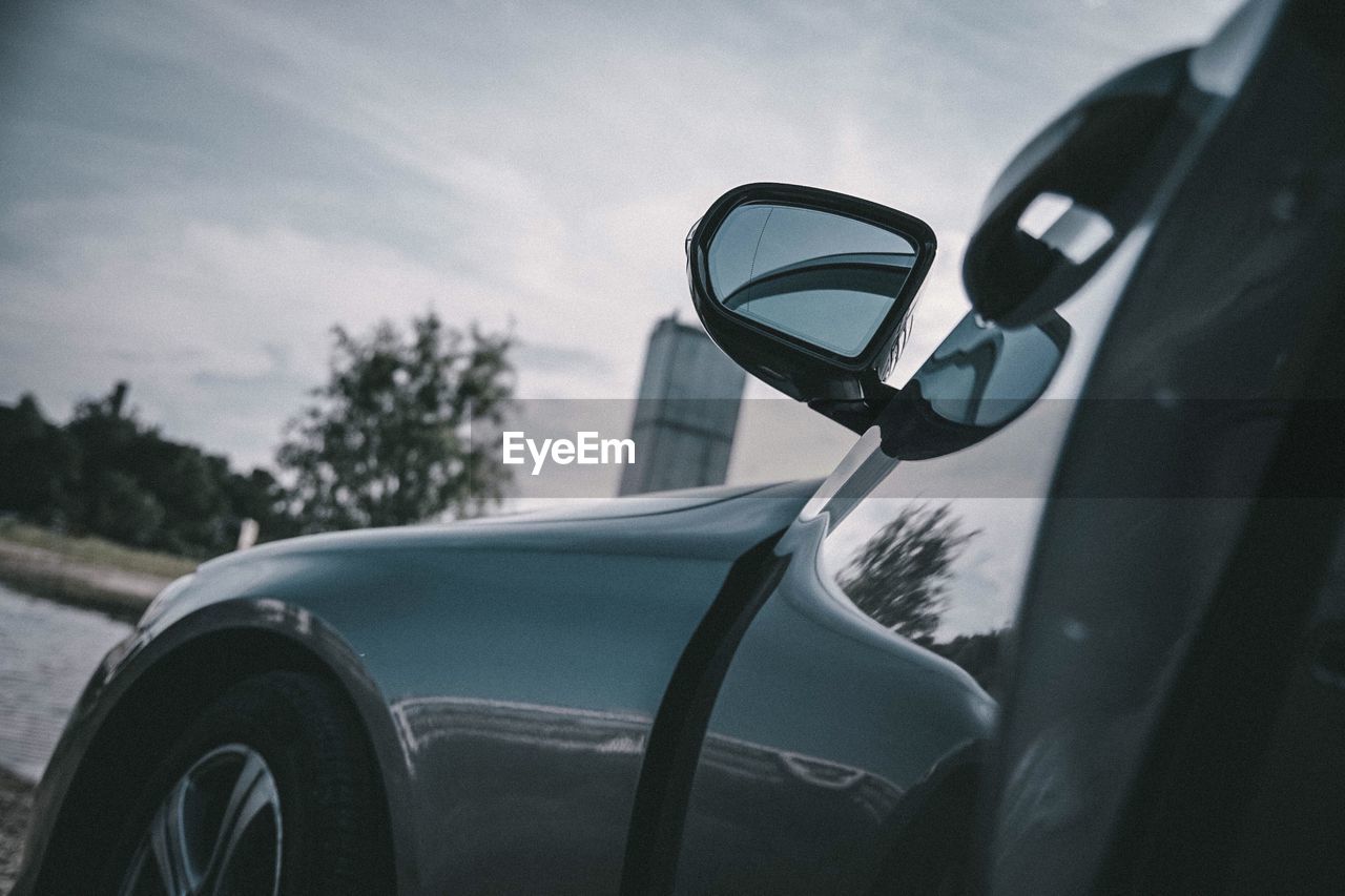 Close-up of car against sky