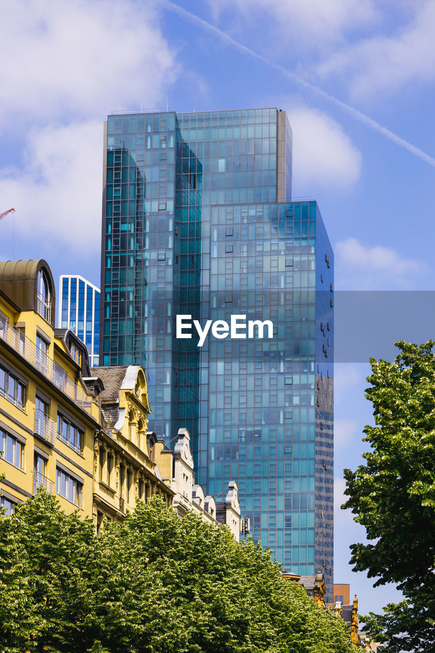 Low angle view of modern buildings against sky