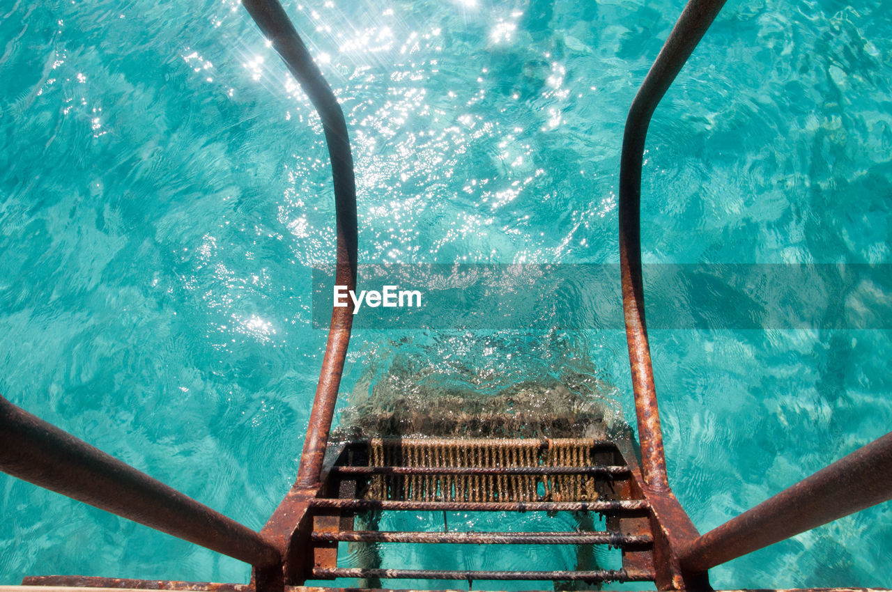 water, swimming pool, nature, no people, railing, day, high angle view, turquoise colored, blue, outdoors, sea, ladder, metal, staircase, azure, nautical vessel