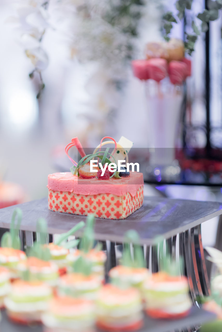 Close-up of cupcakes on table with catering service