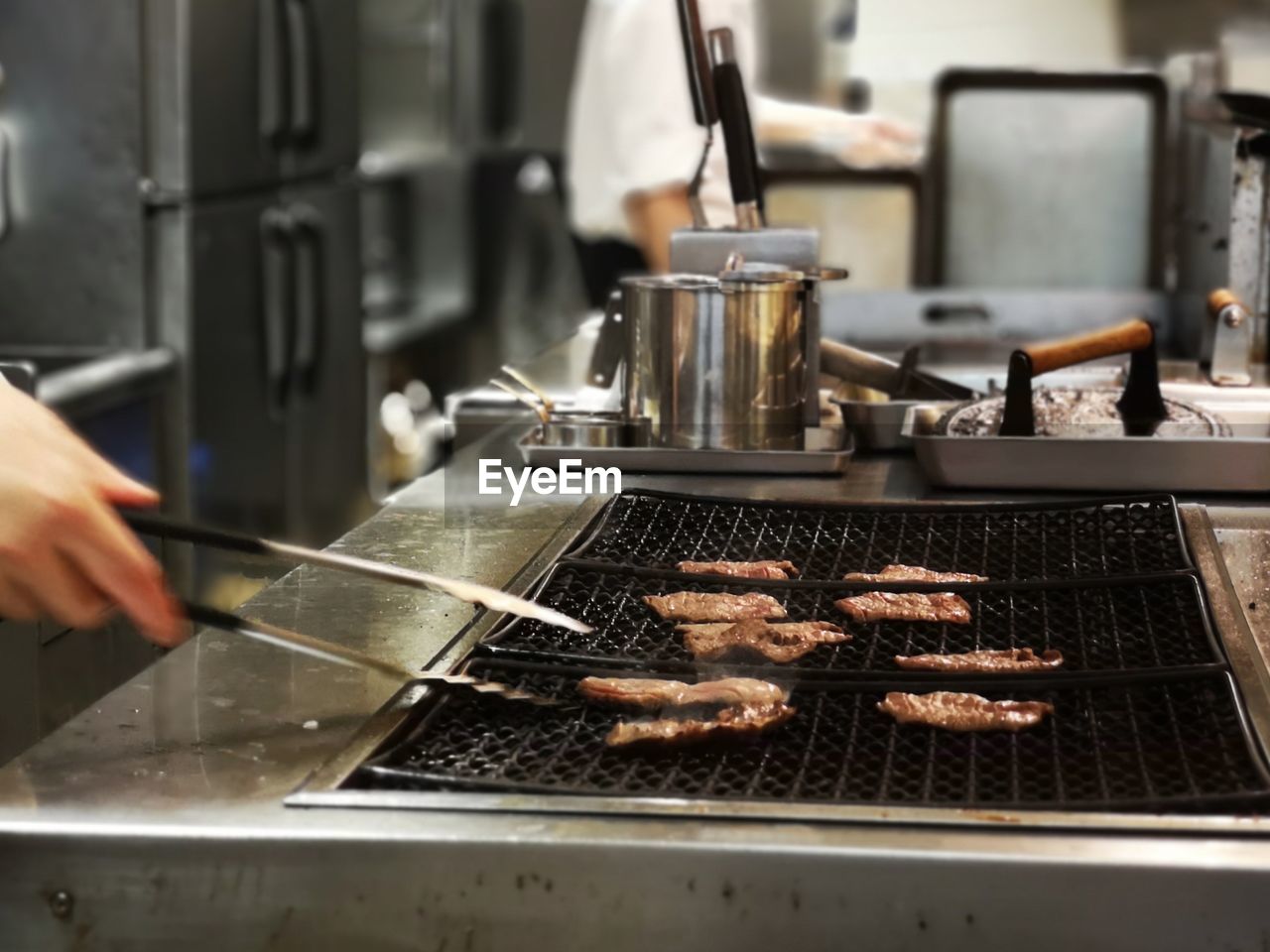 People having food in kitchen