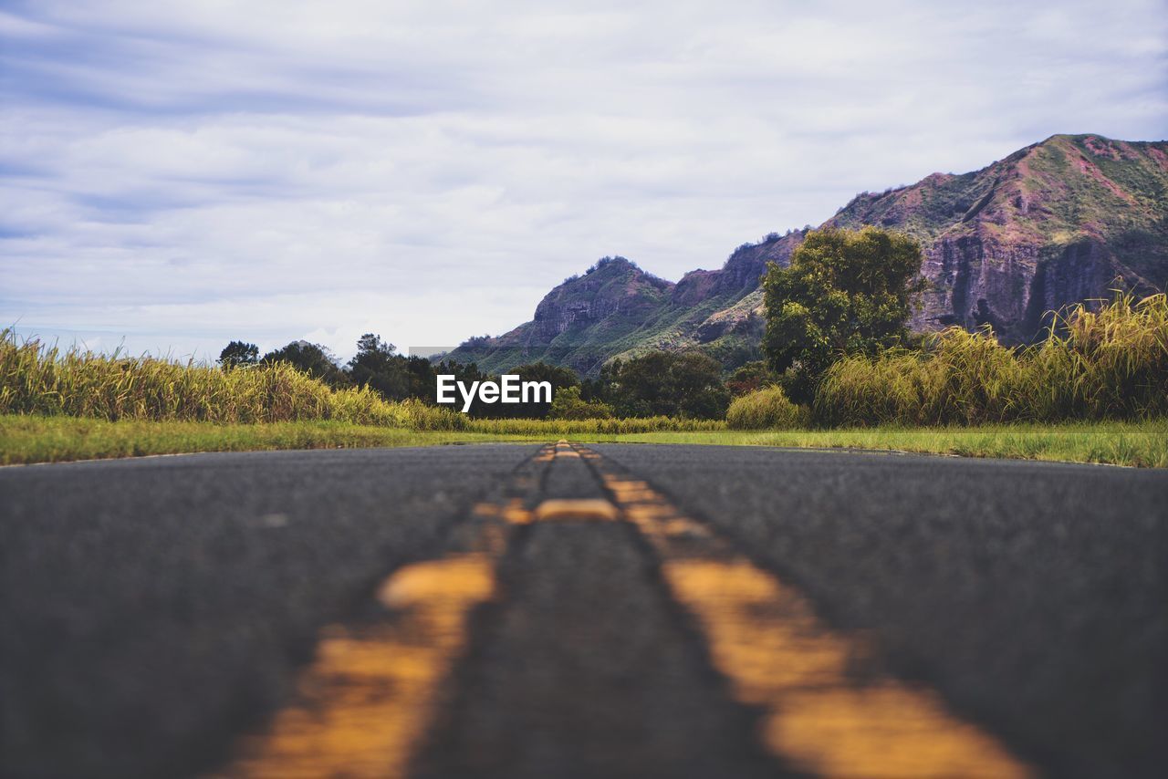 Road amidst landscape against sky