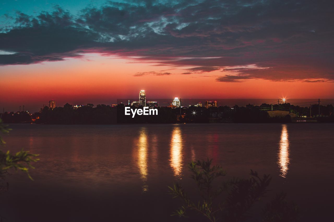 Scenic view of lake at sunset