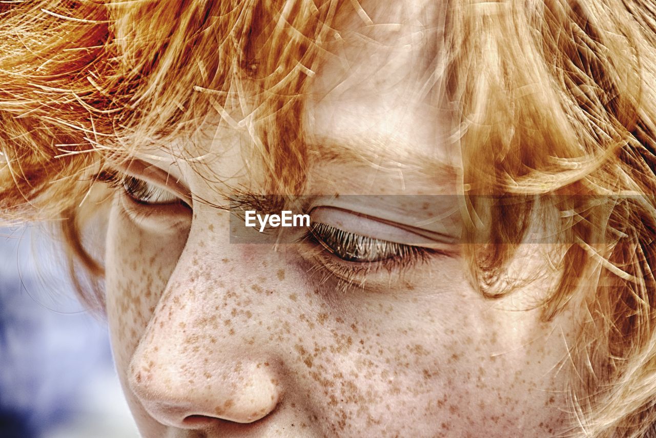 Close-up of boy with freckles on face