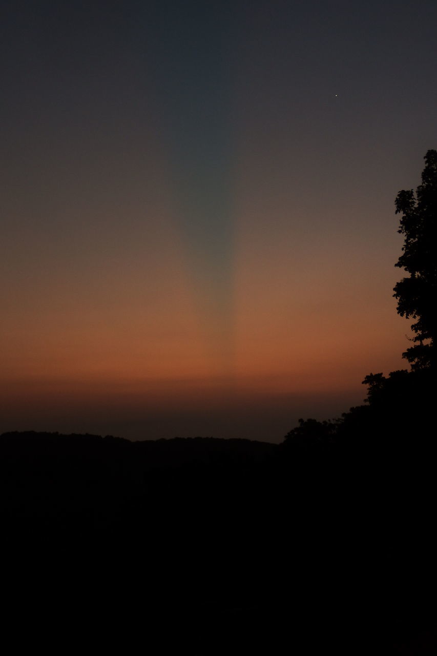 SILHOUETTE LANDSCAPE AGAINST CLEAR SKY DURING SUNSET