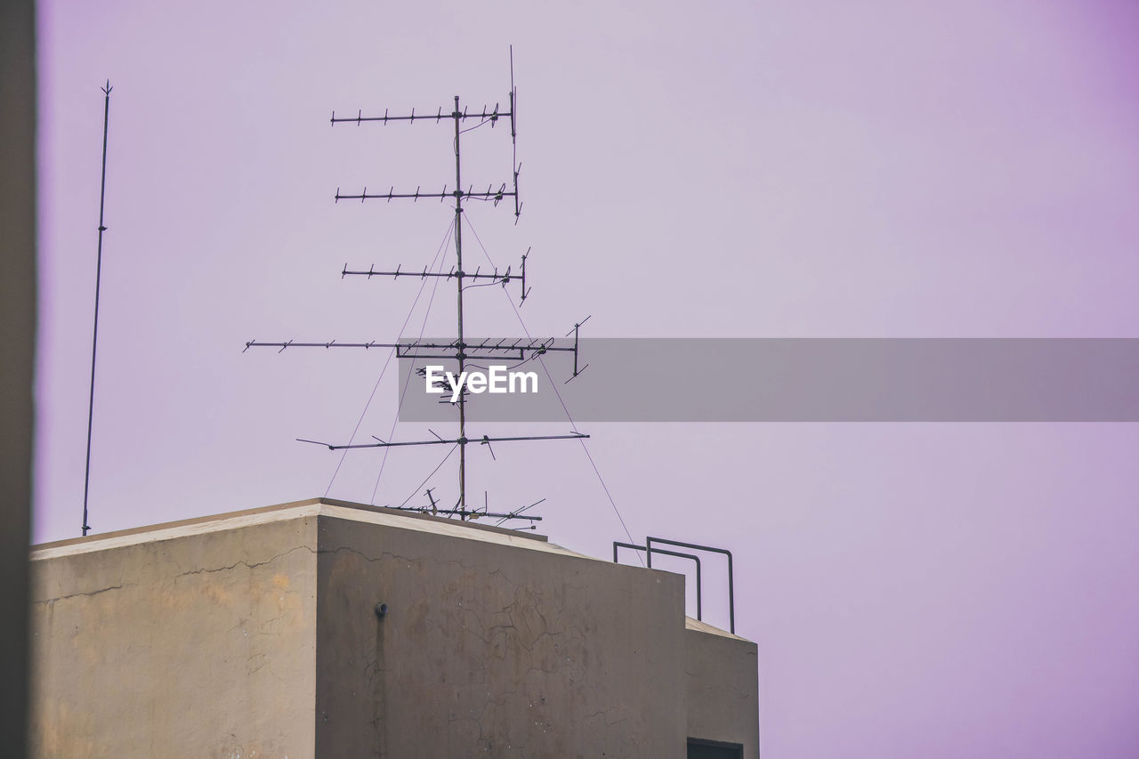 LOW ANGLE VIEW OF TELEPHONE POLE AGAINST SKY