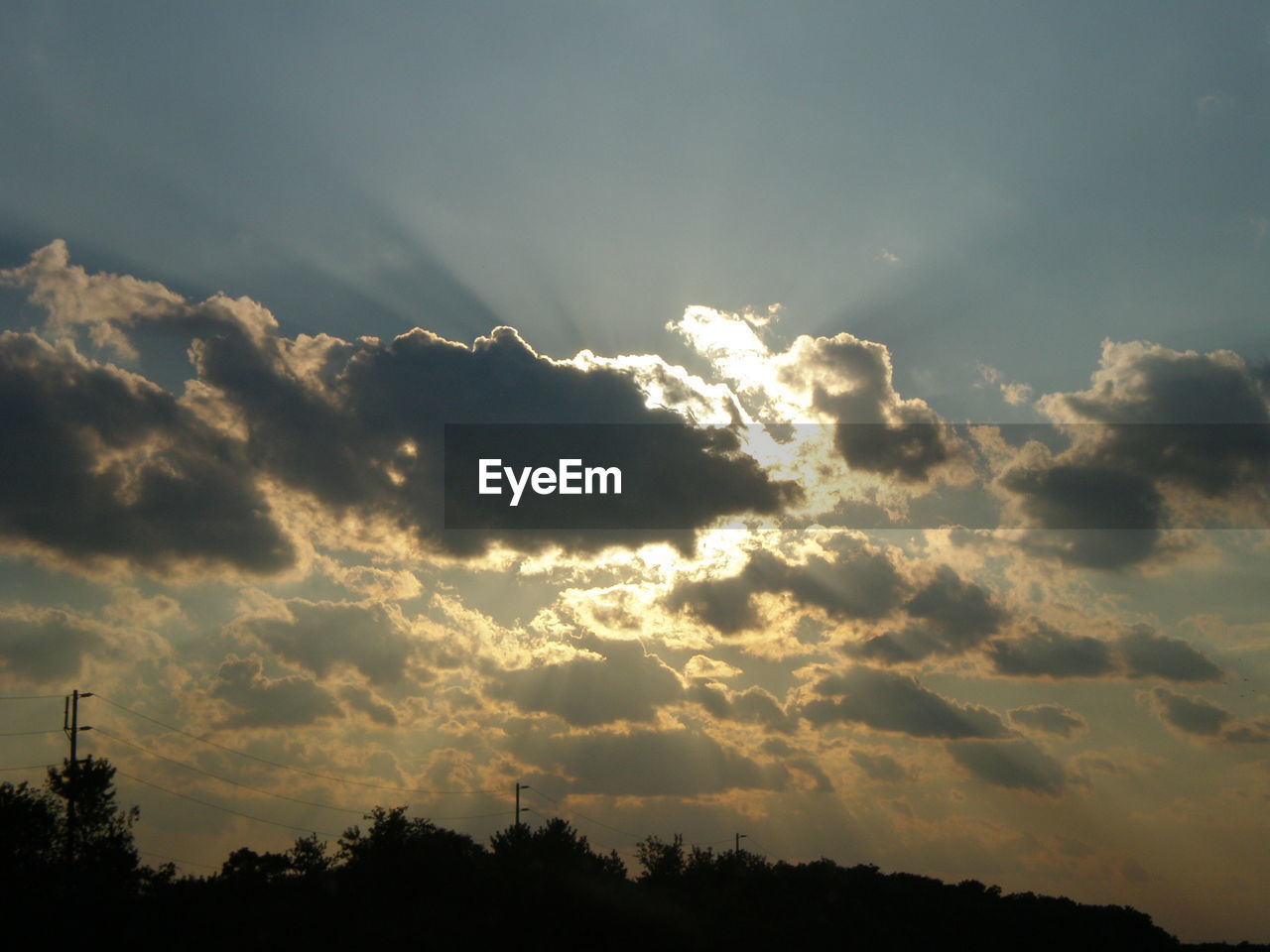 Scenic view of landscape against cloudy sky