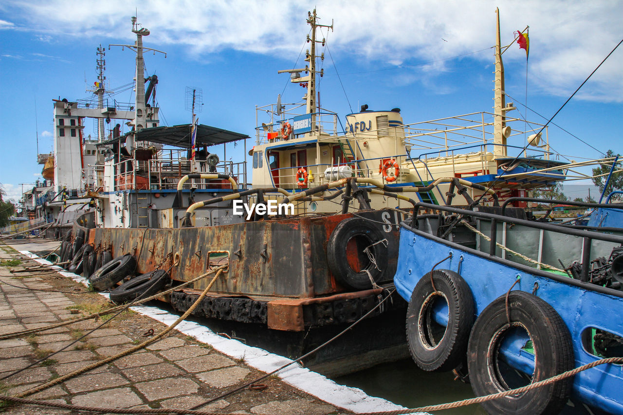 SHIP MOORED ON SHORE