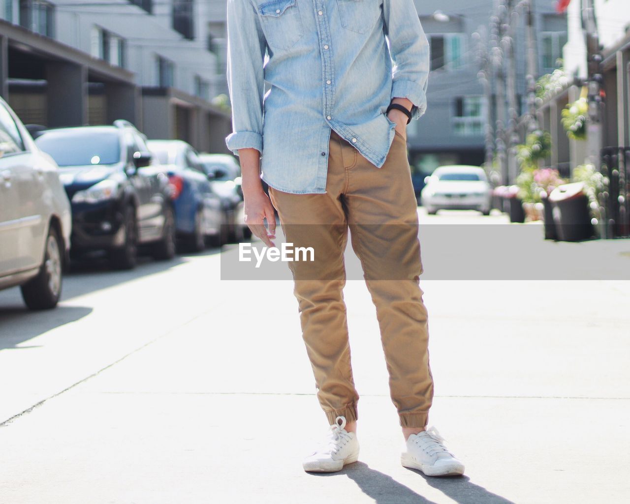 Low section view of man standing on street