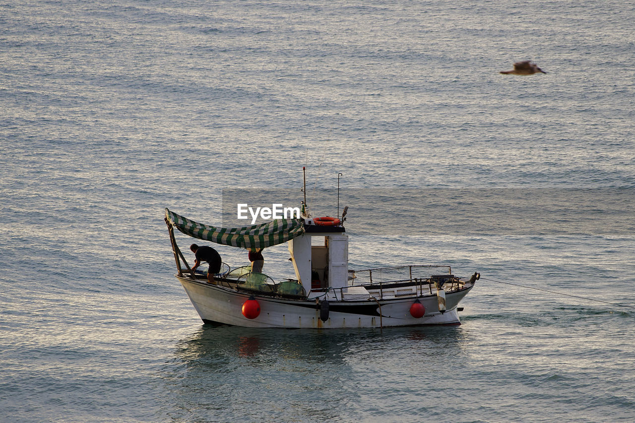 BOAT SAILING ON SEA