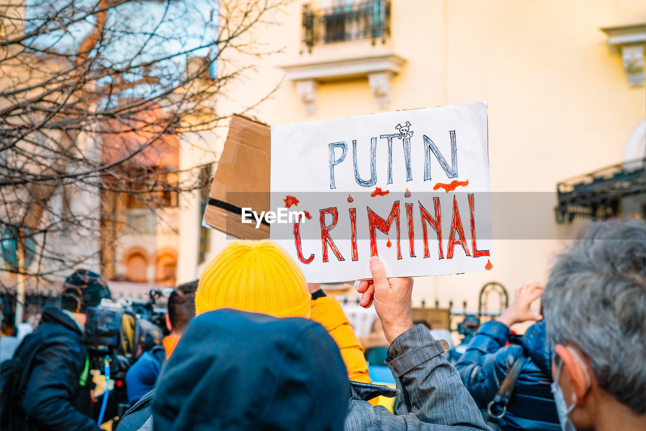 Protesters holding banners at anti-war protest rally