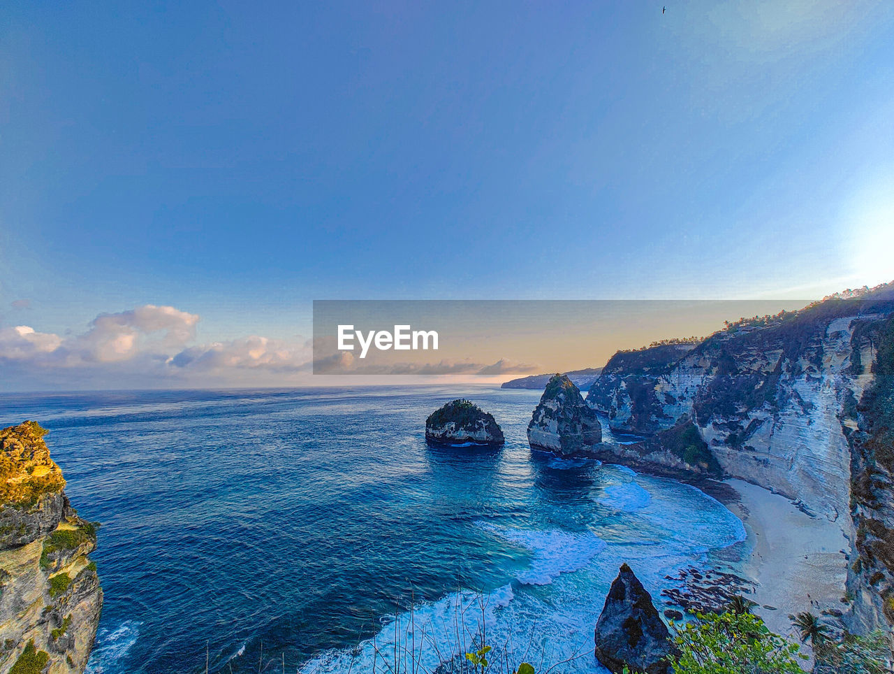 water, sky, sea, scenics - nature, beauty in nature, nature, land, blue, travel, travel destinations, ocean, landscape, environment, beach, coast, body of water, sunset, shore, rock, tranquility, tourism, no people, panoramic, coastline, outdoors, bay, cloud, horizon, tranquil scene, trip, vacation, seascape, holiday, cliff, terrain, clear sky, sun, lagoon, idyllic, horizon over water, reflection, sunlight, bay of water