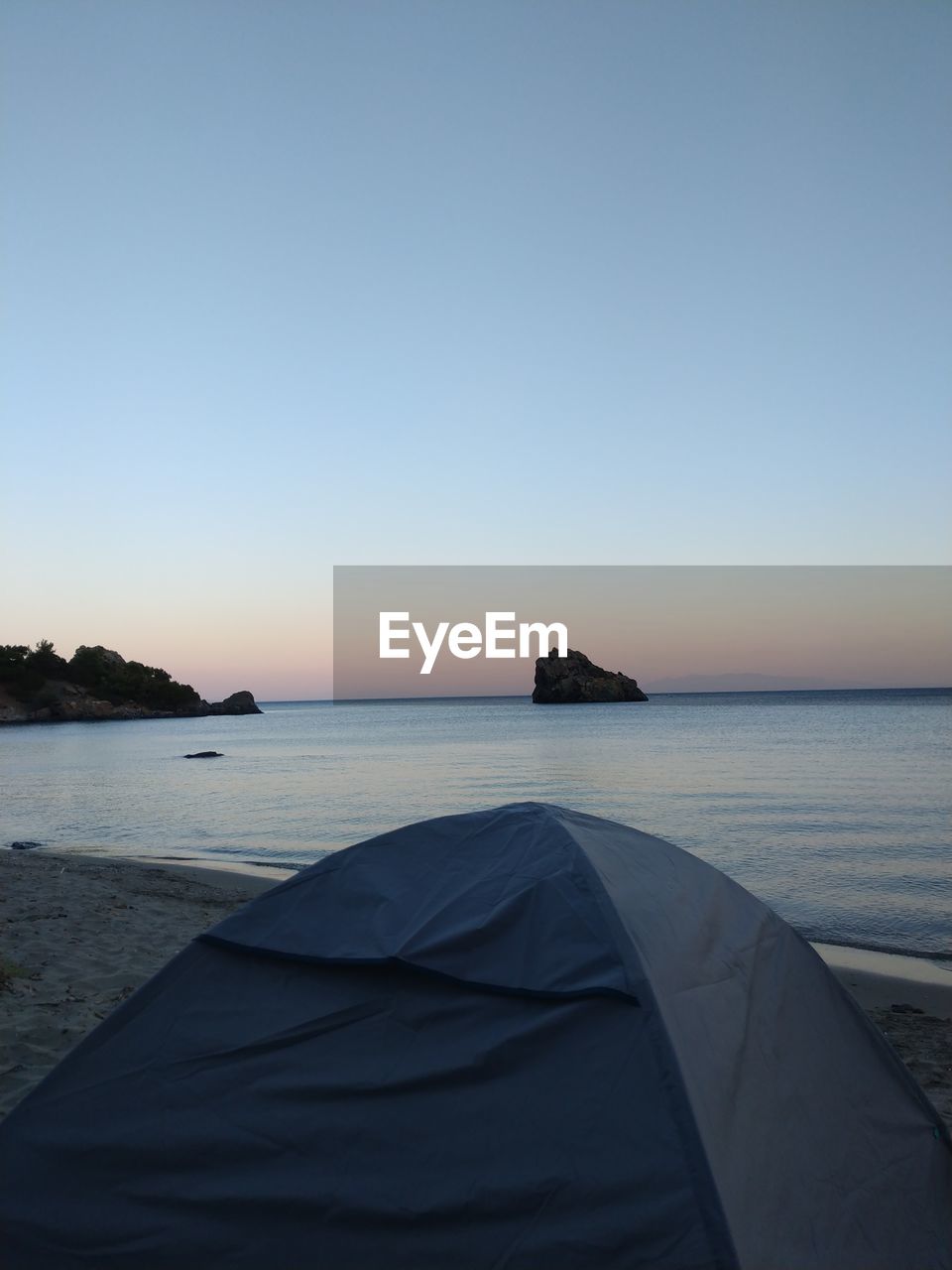 Scenic view of sea against clear sky during sunset