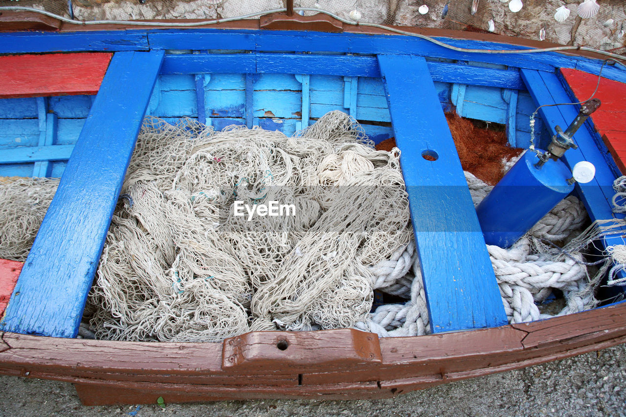 CLOSE-UP OF FISHING NET AND LEAVES