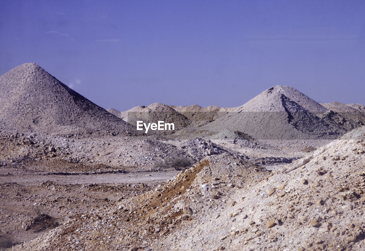 Rock formations at desert against sky