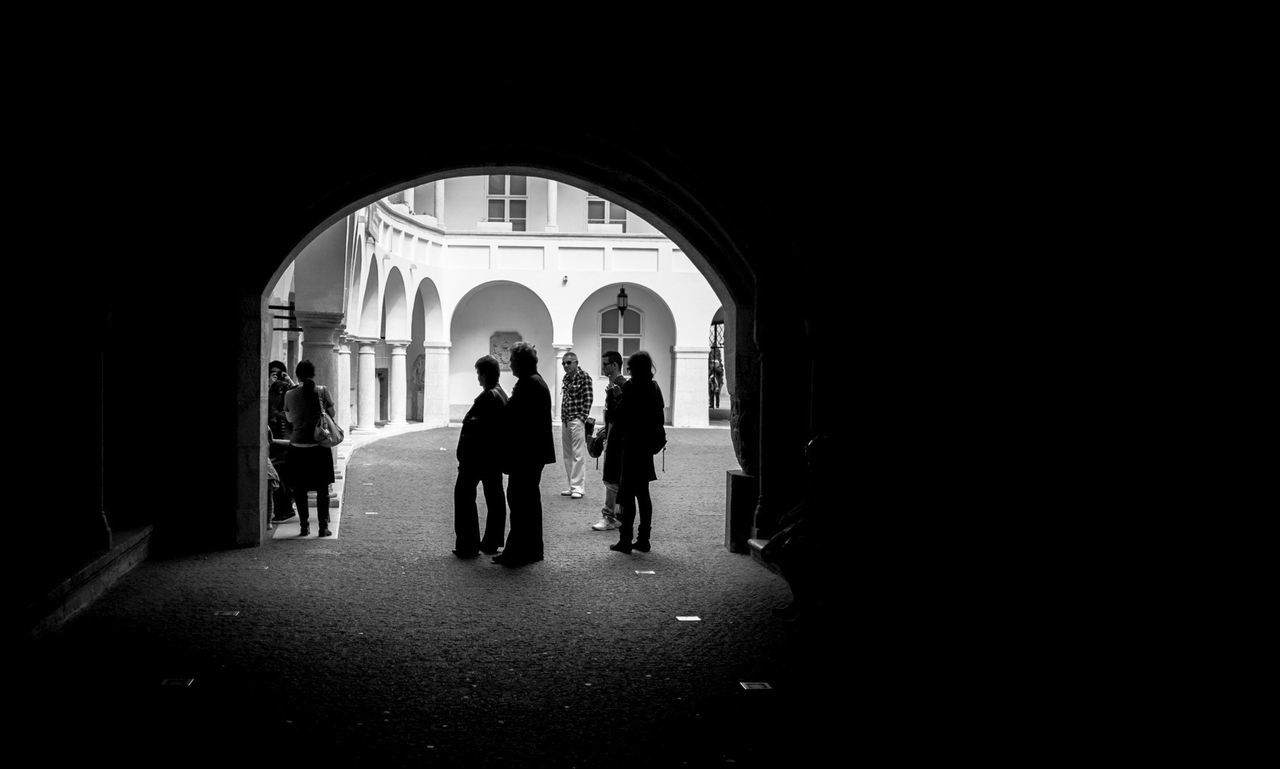 WOMAN WALKING IN TUNNEL