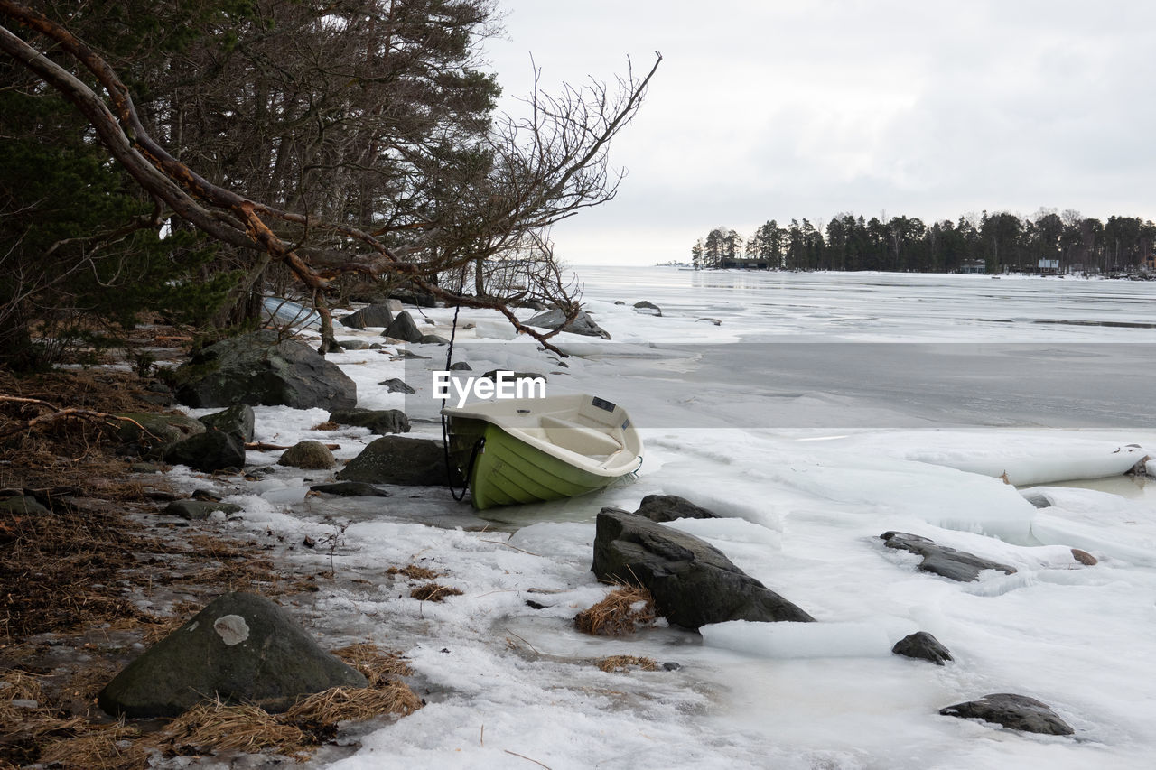 winter, snow, cold temperature, tree, nature, water, environment, plant, land, scenics - nature, landscape, sky, ice, beauty in nature, no people, tranquility, cloud, forest, day, frozen, tranquil scene, river, outdoors, non-urban scene, travel, wilderness, travel destinations, shore, rock, overcast