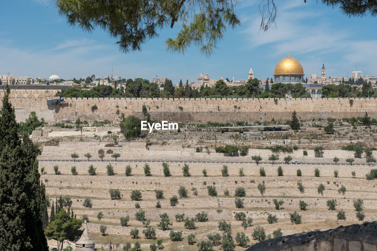 The old city walls of jerusalem, israel. view from the gethsemane garden, mount of olives