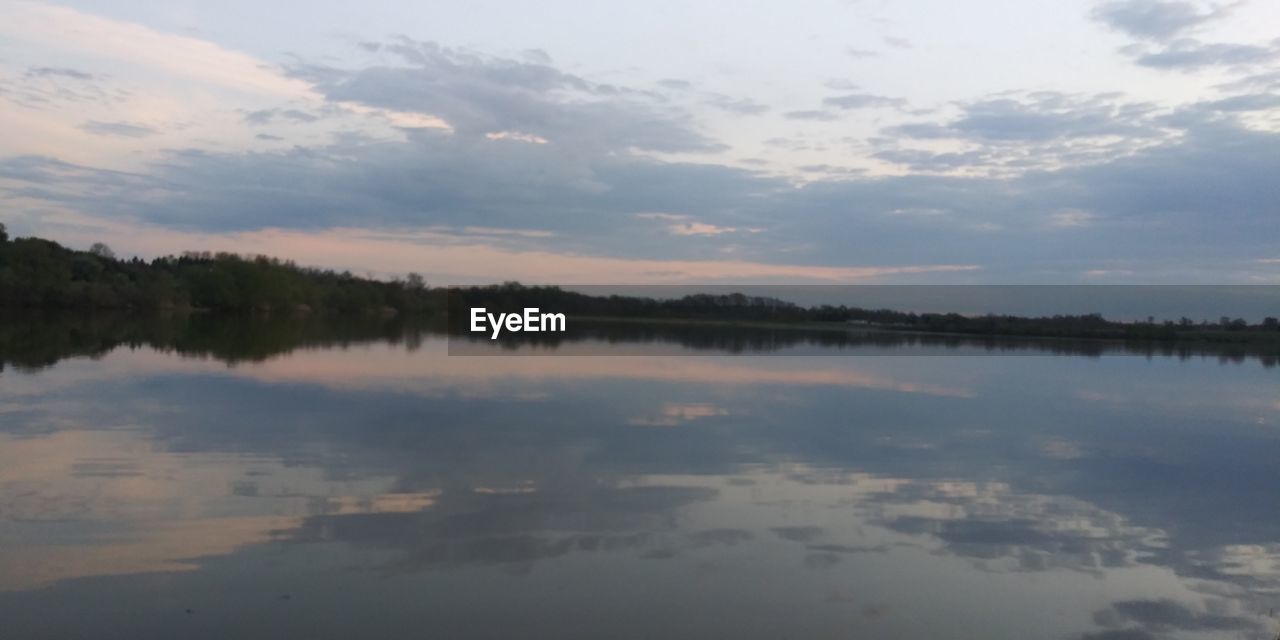 SCENIC VIEW OF LAKE BY TREES AGAINST SKY