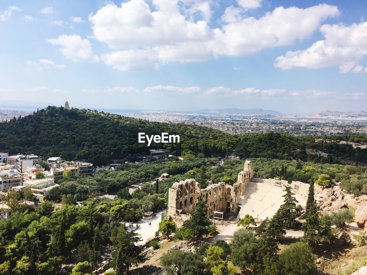 High angle view of old ruin with trees against sky