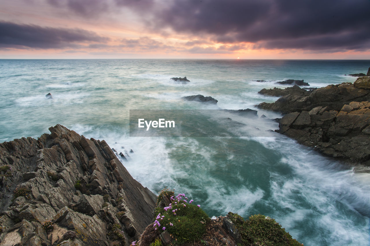 Scenic view of sea against sky during sunset