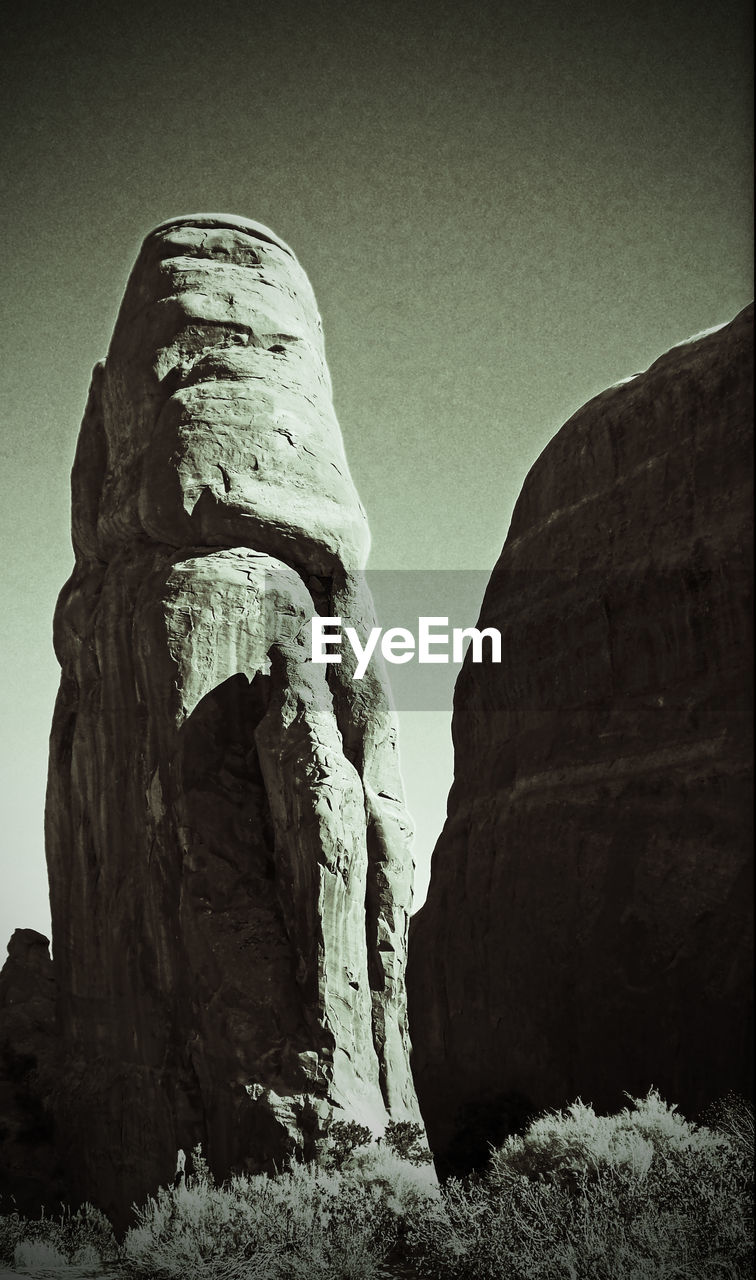 LOW ANGLE VIEW OF ROCK FORMATIONS AGAINST SKY