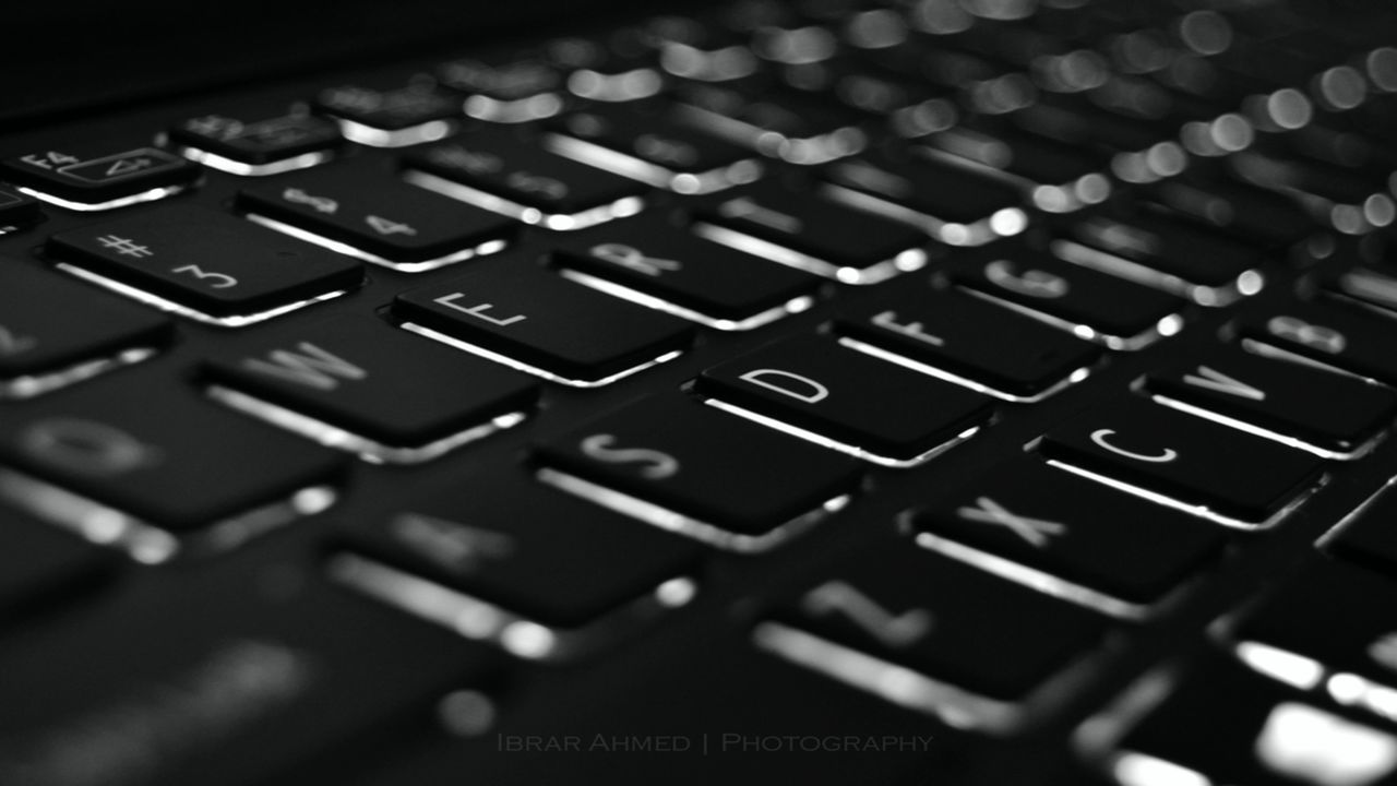 CLOSE-UP OF COMPUTER KEYBOARD AT CAMERA