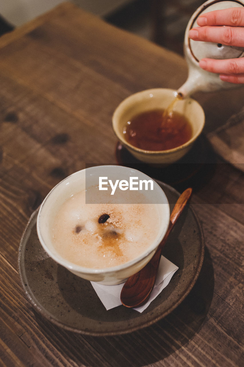 High angle view of coffee cup on table