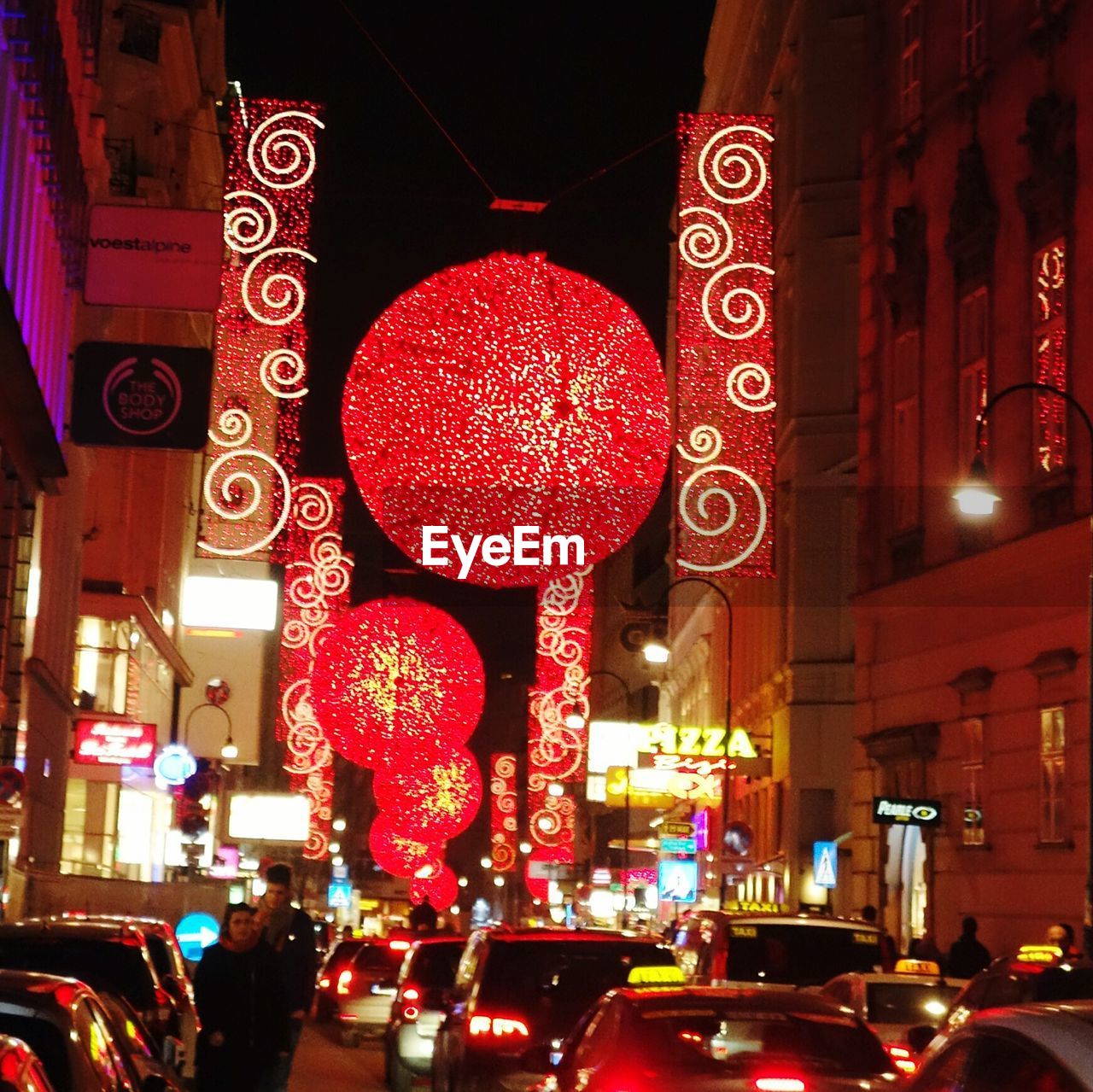 ILLUMINATED CITY STREET AT NIGHT