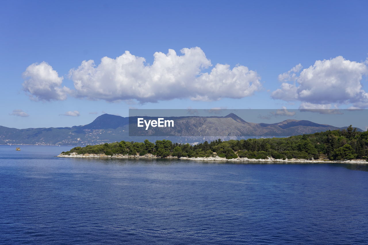 Scenic view of sea against blue sky