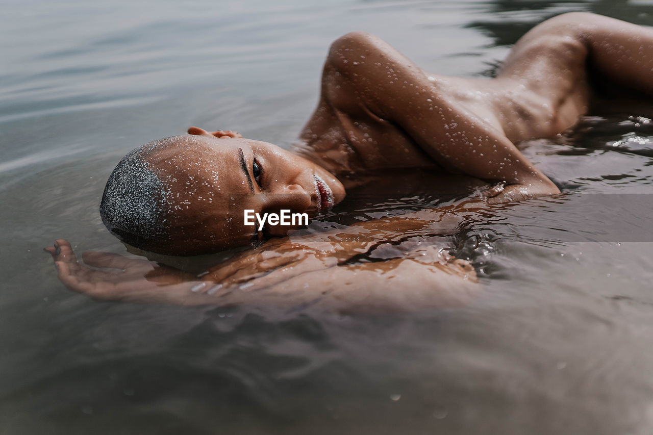 Low section of person in water