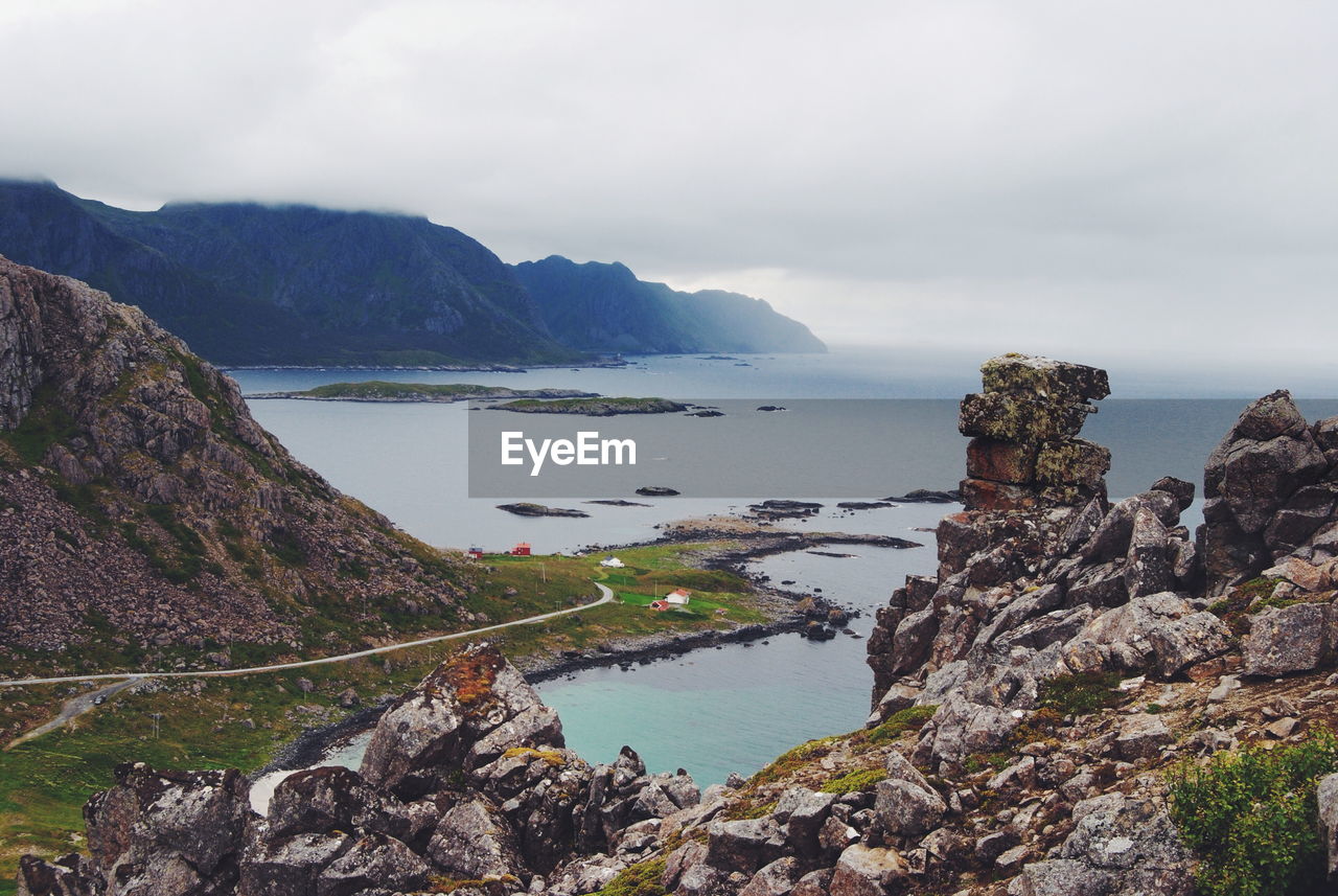 High angle view of sea and landscape against sky