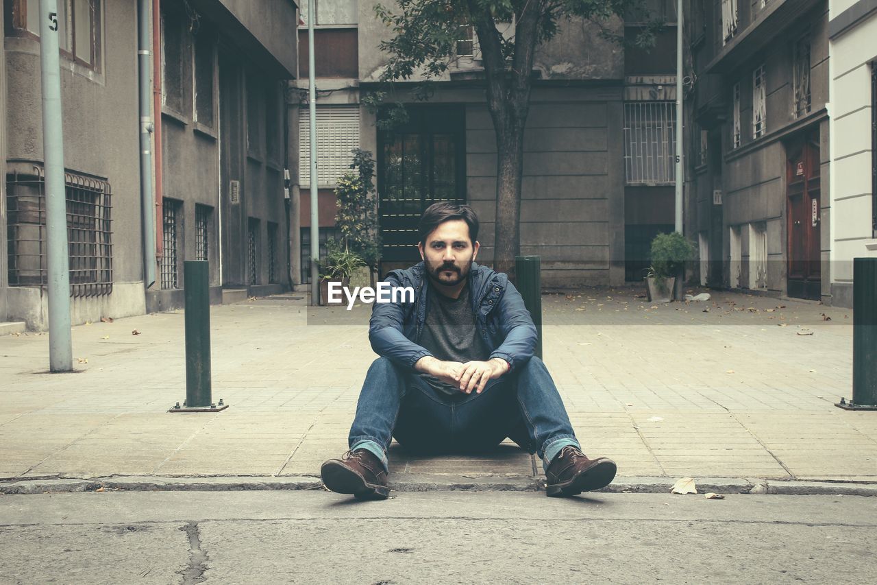 Portrait of man sitting outdoors