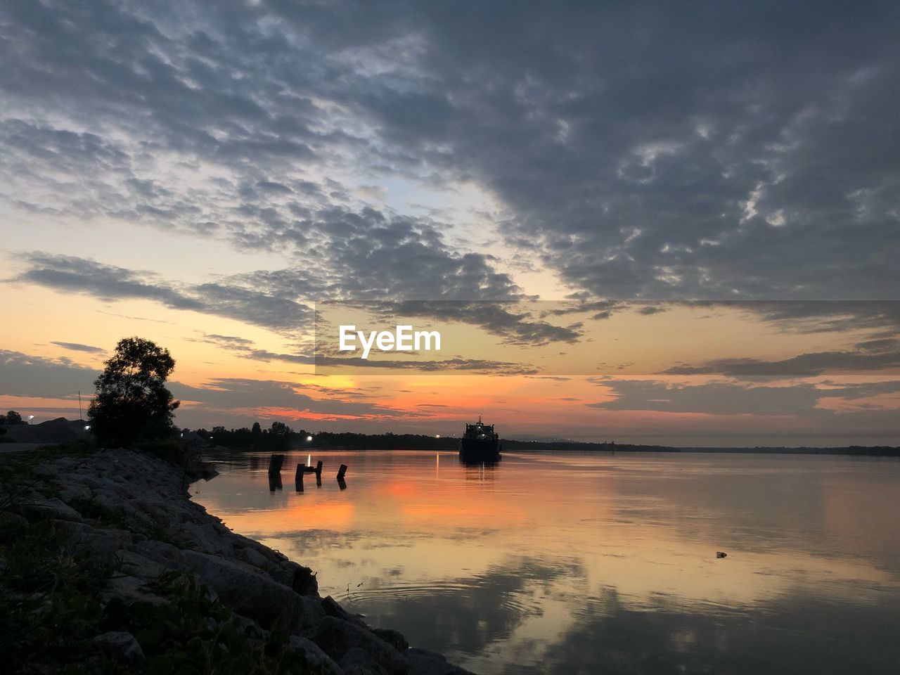 SCENIC VIEW OF LAKE DURING SUNSET