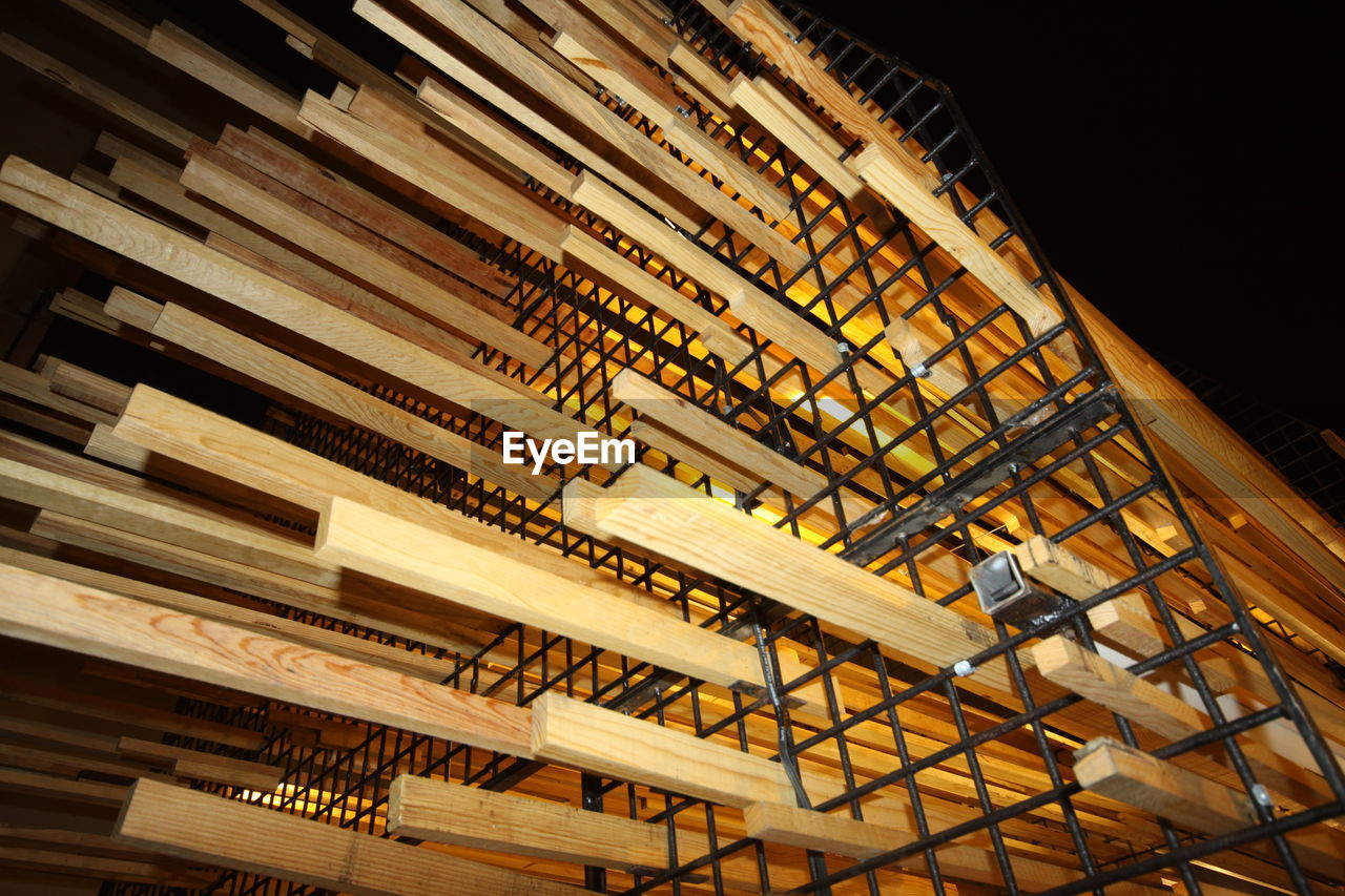 LOW ANGLE VIEW OF ILLUMINATED CEILING AT NIGHT