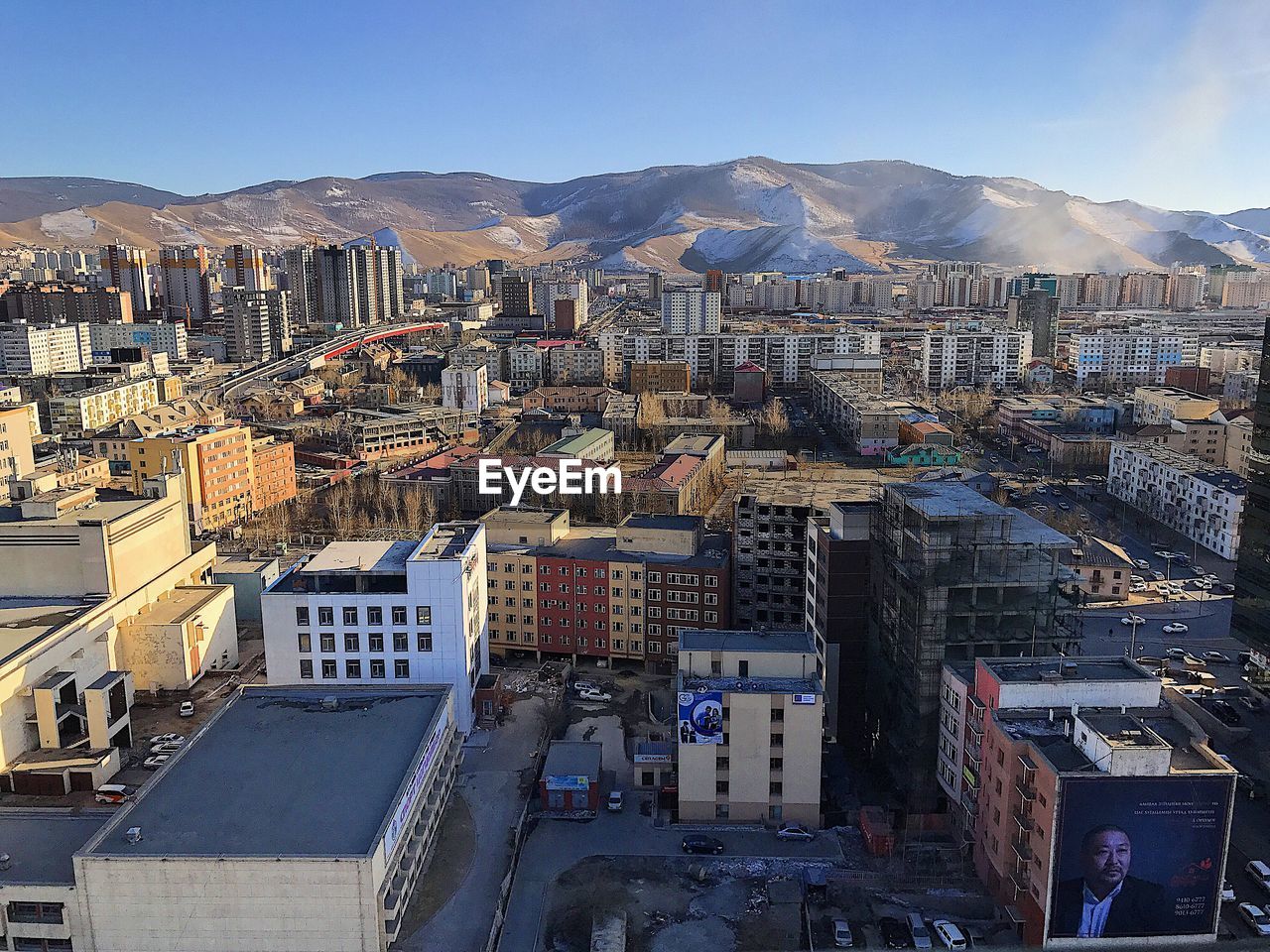 HIGH ANGLE VIEW OF CITY AGAINST SKY