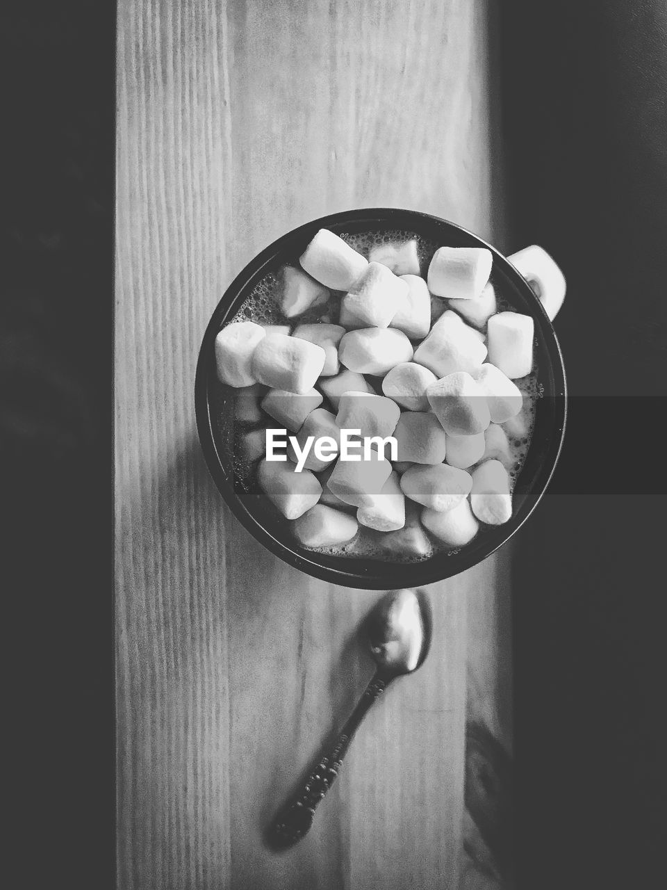 Directly above shot of hot chocolate with marshmallow on table