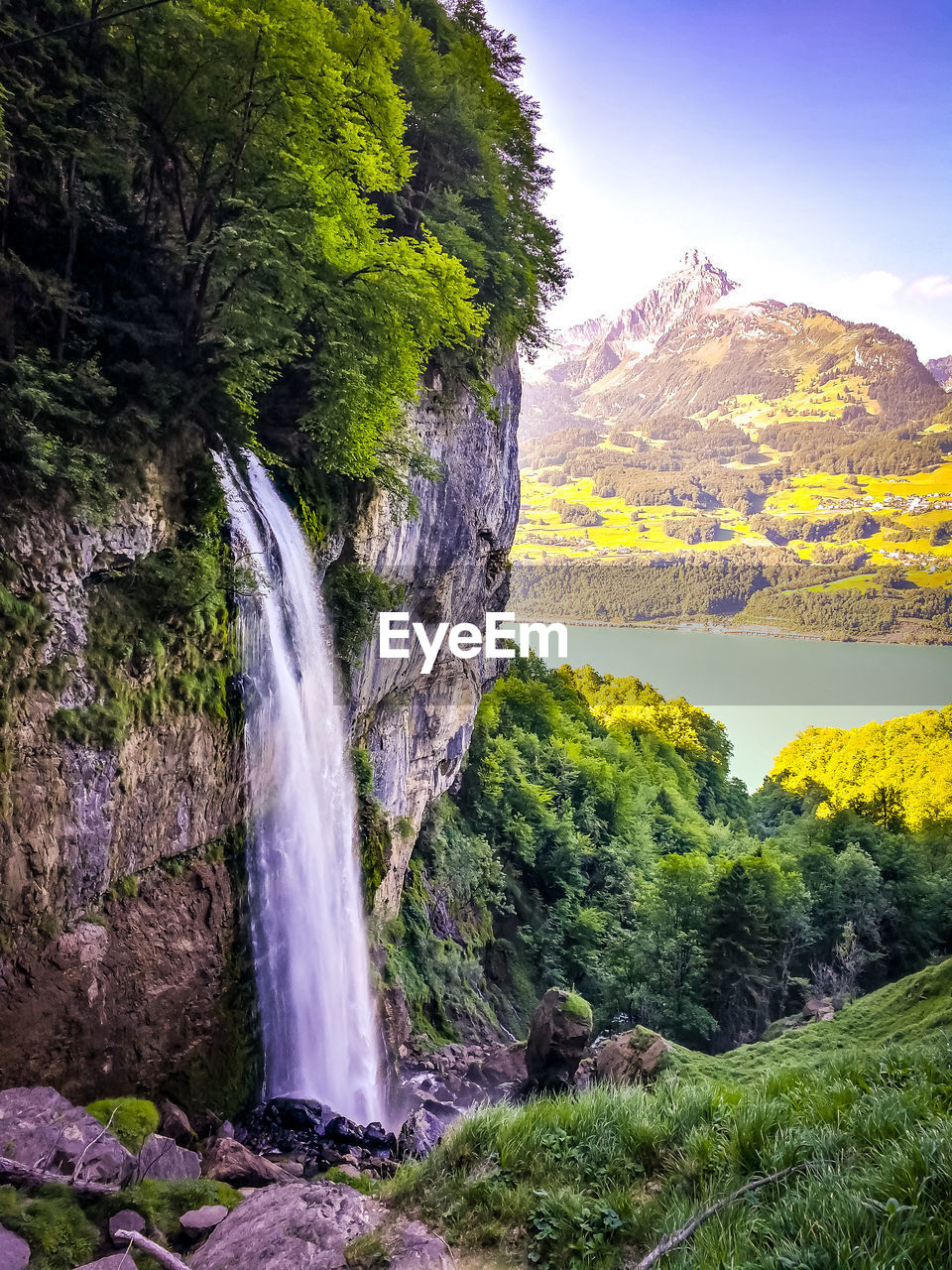 Scenic view of waterfall over cliff