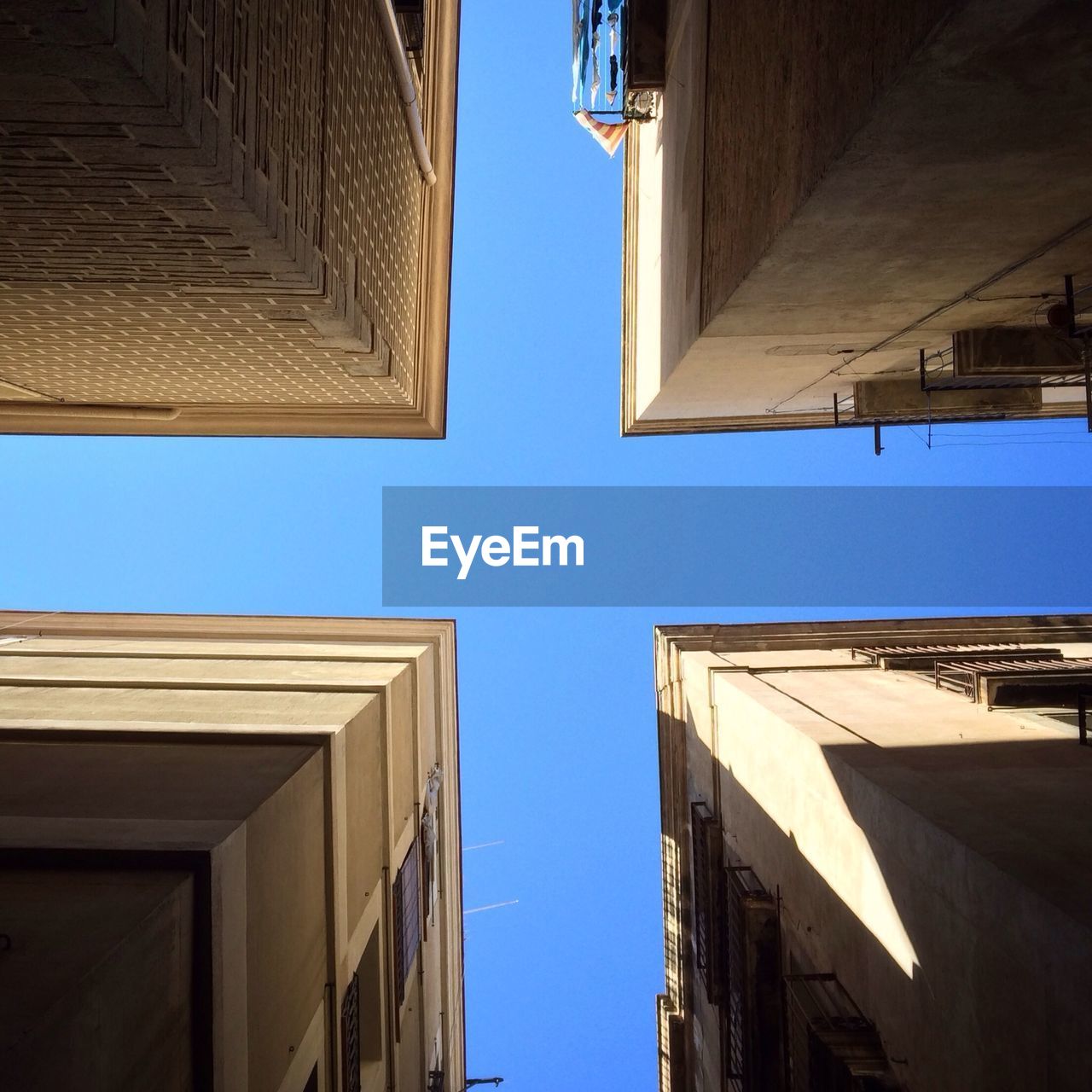 LOW ANGLE VIEW OF BUILDINGS AGAINST SKY