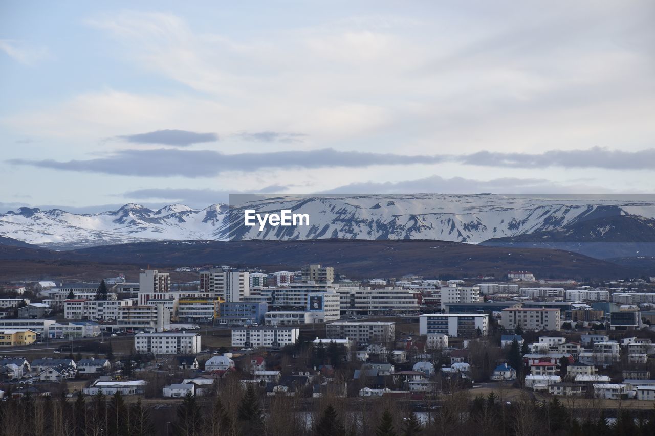 Aerial view of townscape against sky