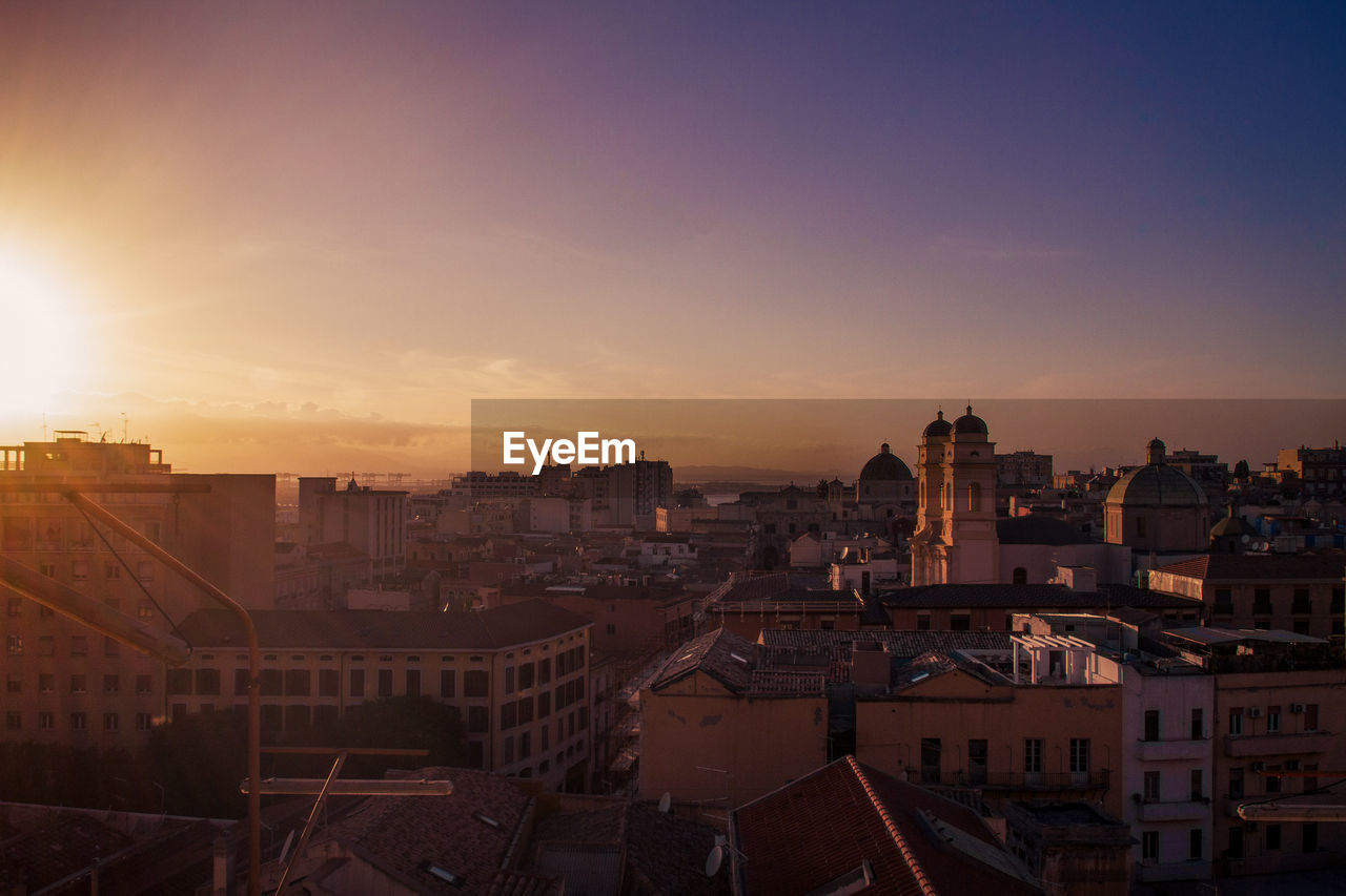 High angle view of townscape against sky at sunset