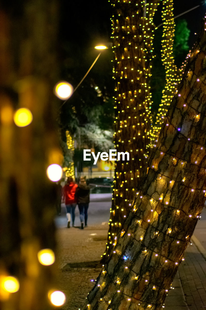 ILLUMINATED CITY STREET AT NIGHT