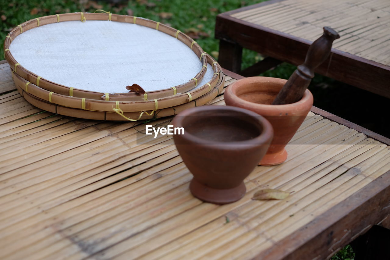 High angle view of mortar and pestle on table